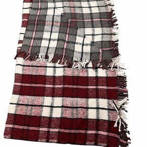 Plaid  reversible super warm blanket in Red and white, then pink and charcoal.